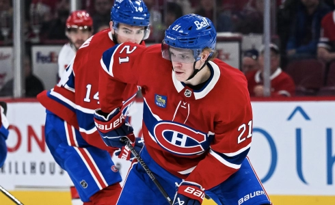 Apr 16, 2025; Montreal, Quebec, CAN; Montreal Canadiens defenseman Kaiden Guhle (21) plays the puck against the Carolina Hurricanes in the second period at Bell Centre.