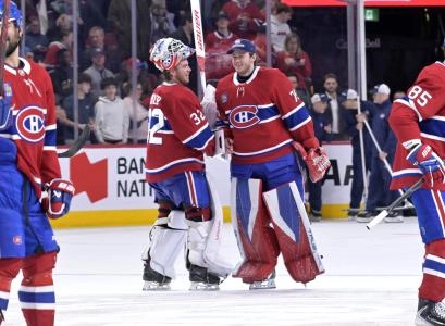 Jan 7, 2026; Montreal, Quebec, CAN; Montreal Canadiens players including goalies Jacob Fowler (32) and Jakub Dobes (75) celebrates the win against the Calgary Flames at the Bell Centre. Mandatory Credit: Eric Bolte-Imagn Images