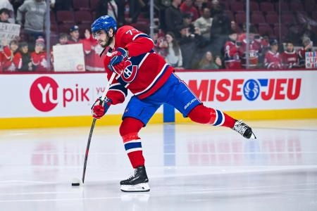 Nov 13, 2025; Montreal, Quebec, CAN; Montreal Canadiens center Kirby Dach (77) shoots a puck during warm-up before the game against the Dallas Stars at Bell Centre.