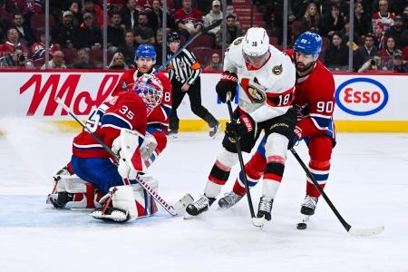 Dec 2, 2025; Montreal, Quebec, CAN; Montreal Canadiens center Joseph Veleno (90) defends against Ottawa Senators center Tim Stutzle (18) during the third period at Bell Centre. Mandatory Credit: David Kirouac-Imagn Images