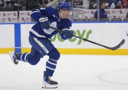 Jan 27, 2026; Toronto, Ontario, CAN; Toronto Maple Leafs forward Bobby McMann (74) shoots the puck during warm up before a game against the Buffalo Sabres at Scotiabank Arena
