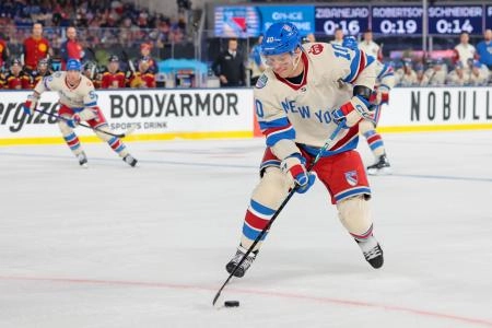 Jan 2, 2026; Miami, Florida, USA; New York Rangers left wing Artemi Panarin (10) controls the puck against the Florida Panthers during the first period in the 2026 Winter Classic ice hockey game at loanDepot Park.