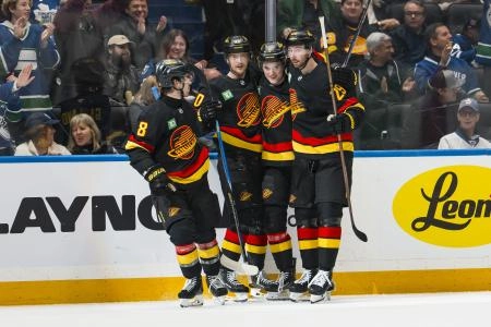 Jan 31, 2026; Vancouver, British Columbia, CAN; Vancouver Canucks forward Conor Garland (8) and forward Elias Pettersson (40) and defenseman Tom Willander (5) and defenseman Marcus Pettersson (29) celebrate Willander's goal against the Toronto Maple Leafs in the second period at Rogers Arena.