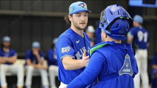 Feb 11, 2026; Dunedin, FL, USA; Toronto Blue Jays pitcher Trey Yesavage (39) and catcher Alejandro Kirk (30) greet after the bullpen session for spring training practice at Blue Jays Player Development Complex. Mandatory Credit: Kim Klement Neitzel-Imagn Images