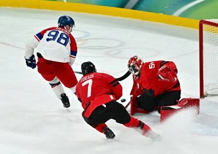 [US, Mexico  Canada customers only] Feb 18, 2026; Milan, Italy; Martin Necas of Czech Republic in action with Jordan Binnington of Canada in a men's ice hockey quarterfinal during the Milano Cortina 2026 Olympic Winter Games at Milano Santagiulia Ice Hockey Arena.
