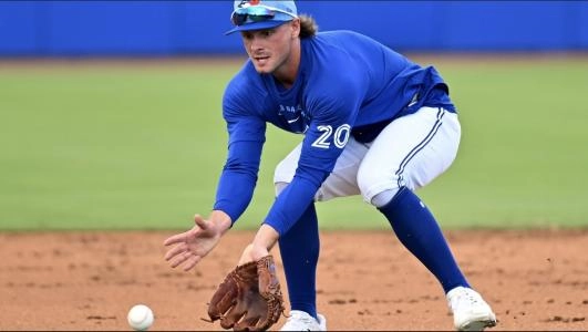 Feb 19, 2026; Dunedin, FL, USA;] Toronto Blue Jays infielder Ben Cowles (20) fields a ground ball during spring training at Bobby Mattick Training Center at Englebert Complex. Mandatory Credit: Jonathan Dyer-Imagn Images