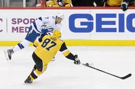 Jan 30, 2019; Pittsburgh, PA, USA; Tampa Bay Lightning right wing Mathieu Joseph (7) moves the puck against Pittsburgh Penguins center Sidney Crosby (87) during the second period at PPG PAINTS Arena. Pittsburgh won 4-2. Mandatory Credit: