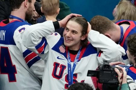 Feb 22, 2026; Milan, Italy; Jack Hughes of the United States celebrates after winning the mens ice hockey gold medal game during the Milano Cortina 2026 Olympic Winter Games at Milano Santagiulia Ice Hockey Arena