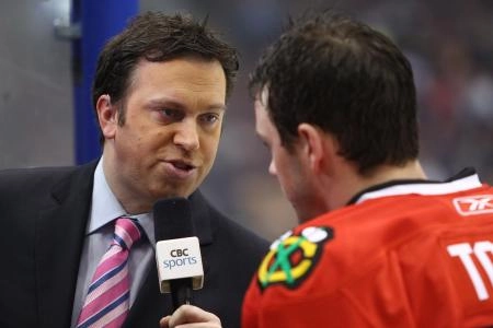 Mar 5, 2011; Toronto, ON, Canada; CBC sportscaster Elliotte Friedman talks to Chicago Blackhawks center Jonathan Toews (19) before the game against the Toronto Maple Leafs at the Air Canada Centre. The Blackhawks beat the Maple Leafs 5-3.