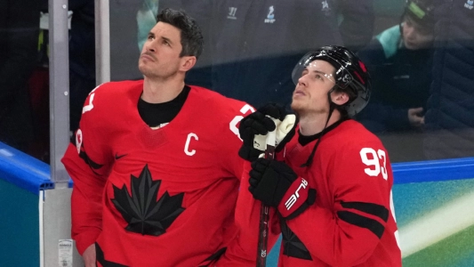 Feb 22, 2026; Milan, Italy; Sidney Crosby (87) and Mitch Marner (93) of Canada look on after losing to the United States in the mens ice hockey gold medal game during the Milano Cortina 2026 Olympic Winter Games at Milano Santagiulia Ice Hockey Arena.