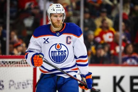 Dec 27, 2025; Calgary, Alberta, CAN; Edmonton Oilers center Connor McDavid (97) skates against the Calgary Flames during the second period at Scotiabank Saddledome. Mandatory Credit: Sergei Belski-Imagn Images