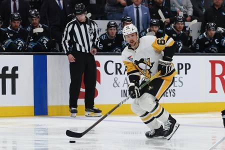 Mar 14, 2026; Salt Lake City, Utah, USA; Pittsburgh Penguins defenseman Erik Karlsson (65) skates with the puck against the Utah Mammoth during the third period at Delta Center. Mandatory Credit: Rob Gray-Imagn Images