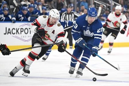 Feb 28, 2026; Toronto, Ontario, CAN; Ottawa Senators defenseman Thomas Chabot (72) plays the puck away from Toronto Maple Leafs forward Matthew Knies (23) in the first period at Scotiabank Arena. Mandatory Credit: Dan Hamilton-Imagn Images