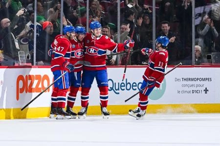Mar 17, 2026; Montreal, Quebec, CAN; Montreal Canadiens center Nick Suzuki (14) celebrates with his teammates his goal against the Boston Bruins during the first period at Bell Centre. Mandatory Credit: David Kirouac-Imagn Images