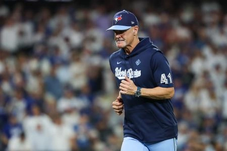 Oct 29, 2025; Los Angeles, California, USA; Toronto Blue Jays pitching coach Pete Walker (41) jogs off the field during the eighth inning against the Los Angeles Dodgers during game five of the 2025 MLB World Series at Dodger Stadium.