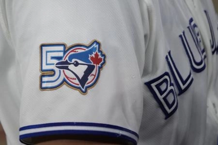 Mar 29, 2026; Toronto, Ontario, CAN; The Toronto Blue Jays 50th anniversary logo displayed on the jersey of third baseman Kazuma Okamoto (7) duringa game against the Athletics at Rogers Centre