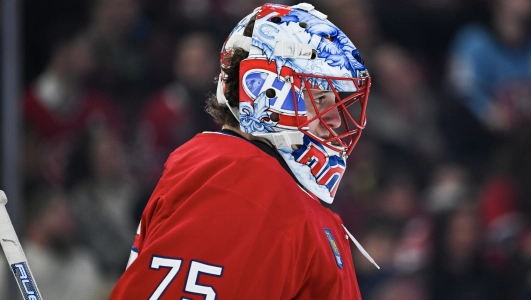 14 mars 2026 ; Montr�al, Qu�bec, Canada ; Le gardien des Canadiens de Montr�al, Jakub Dobes (75), observe le jeu face aux Sharks de San Jos� lors de la premi�re p�riode au Centre Bell.