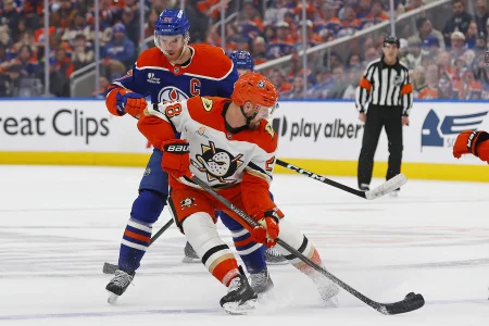 Apr 22, 2026; Edmonton, Alberta, CAN;Anaheim Ducks forward Jeff Viel (28) knocks the puck away from Edmonton Oilers forward Connor McDavid (97) during the third period in game two of the first round of the 2026 Stanley Cup Playoffs at Rogers Place.