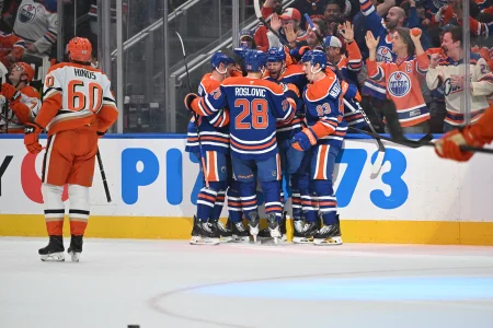 Apr 20, 2026; Edmonton, Alberta, CAN; Edmonton Oilers center Jack Roslovic (28), center Jason Dickinson (16) and center Ryan Nugent-Hopkins (93) celebrate a goal on the Anaheim Ducks in game one of the first round of the 2026 Stanley Cup Playoffs during the first period at Rogers Place.