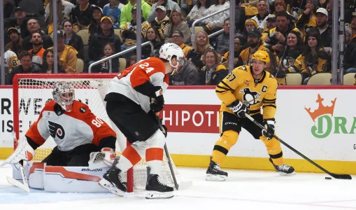 Apr 20, 2026; Pittsburgh, Pennsylvania, USA; Pittsburgh Penguins center Sidney Crosby (87) handles the puck as Philadelphia Flyers goaltender Dan Vladar (80) and defenseman Nick Seeler (24) defend during the third period in game two of the first round of the 2026 Stanley Cup Playoffs at PPG Paints Arena.