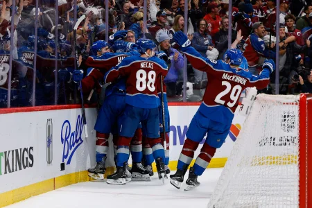 Apr 21, 2026; Denver, Colorado, USA; Colorado Avalanche center Nicolas Roy (10) celebrates his game winning goal with defenseman Josh Manson (42) and center Martin Necas (88) and center Nathan MacKinnon (29) in overtime against the Los Angeles Kings in game two of the first round of the 2026 Stanley Cup Playoffs at Ball Arena.