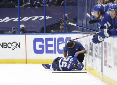 May 22, 2021; Tampa, Florida, USA;Tampa Bay Lightning right wing Nikita Kucherov (86) falls the the ice after an apparent injury against the Florida Panthers during the third period in game four of the first round of the 2021 Stanley Cup Playoffs at Amalie Arena.