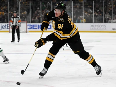Mar 31, 2026; Boston, Massachusetts, USA; Boston Bruins defenseman Nikita Zadorov (91) attempts a shot against the Dallas Stars during the first period at the TD Garden