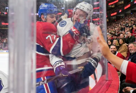 Apr 9, 2026; Montreal, Quebec, CAN; Montreal Canadiens defenseman Arber Xhekaj (72) checks Tampa Bay Lightning forward Corey Perry (10) during the third period at the Bell Centre.