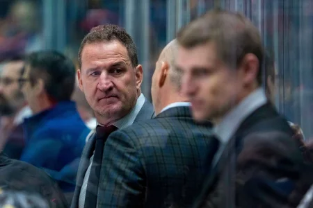 Jan 18, 2025; Vancouver, British Columbia, CAN; Vancouver Canucks assistant coach Adam Foote on the bench against the Edmonton Oilers in the second period at Rogers Arena.