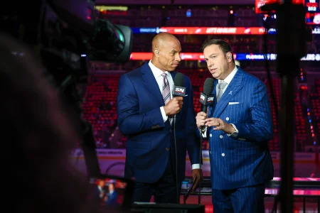 Jun 14, 2025; Edmonton, Alberta, CAN; Sportsnet host David Amber (left) and NHL Insider Elliotte Friedman (right) prior to the game between the Edmonton Oilers and the Florida Panthers in game five of the 2025 Stanley Cup Final at Rogers Place.