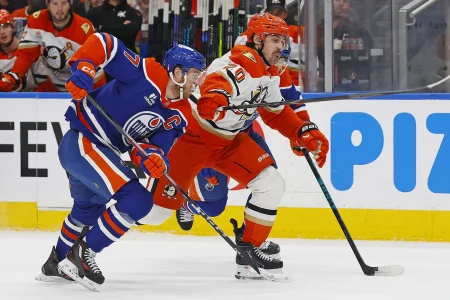 Apr 28, 2026; Edmonton, Alberta, CAN; Edmonton Oilers forward Connor McDavid (97) and Anaheim Ducks forward Chris Kreider (20) chases a loose puck during the second period in game five of the first round of the 2026 Stanley Cup Playoffs at Rogers Place.