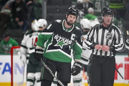 Apr 28, 2026; Dallas, Texas, USA; Dallas Stars left wing Jamie Benn (14) skates off the ice as the Minnesota Wild celebrate their win over the Stars in game five of the first round of the 2026 Stanley Cup Playoffs at American Airlines Center.