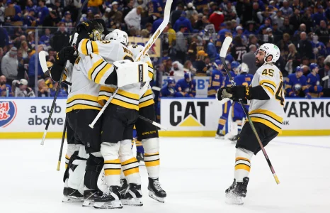 Apr 28, 2026; Buffalo, New York, USA; The Boston Bruins celebrate a win in overtime against the Buffalo Sabres in game five of the first round of the 2026 Stanley Cup Playoffs at KeyBank Center.