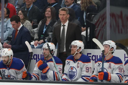 Apr 7, 2026; Salt Lake City, Utah, USA; Edmonton Oilers head coach Kris knoblauch watches play against the Utah Mammoth during the first period at Delta Center.