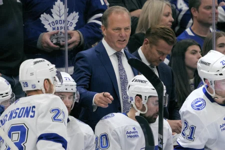 Dec 8, 2025; Toronto, Ontario, CAN; Tampa Bay Lightning head coach Jon Cooper talks to his players during a break in the action against the Toronto Maple Leafs at Scotiabank Arena.