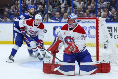 Apr 29, 2026; Tampa, Florida, USA; Montreal Canadiens goaltender Jakub Dobes (75) blocks a shot against the Tampa Bay Lightning in the first period during game five of the first round of the 2026 Stanley Cup Playoffs at Benchmark International Arena.