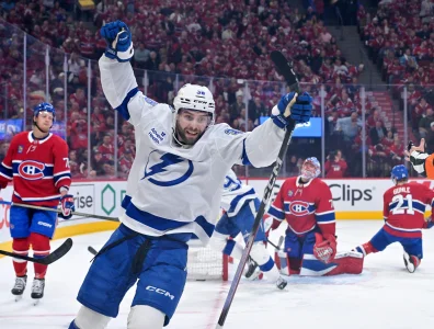 May 1, 2026; Montreal, Quebec, CAN; Tampa Bay Lightning forward Brandon Hagel (38) celebrates after teammate forward Gage Goncalves (93) scores the winning goal against Montreal Canadiens goalie Jakub Dobes (75) during the overtime period in game six of the first round of the 2026 Stanley Cup Playoffs at the Bell Centre.