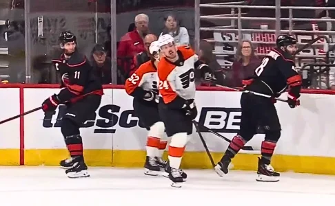 Nick Seeler pulls Martinooks stick into his face for a call
