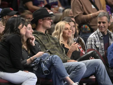 Oct 14, 2022; Montreal, Quebec, CAN; Montreal Canadiens goalie Carey Price (in cowboy hat) and his wife Angela (right) watch the second quarter of the game between the Boston Celtics and the Toronto Raptors at the Bell Centre.