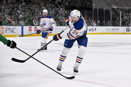 Mar 12, 2026; Dallas, Texas, USA; Edmonton Oilers center Leon Draisaitl (29) passes the puck during the game between the Stars and the Oilers at the American Airlines Center.