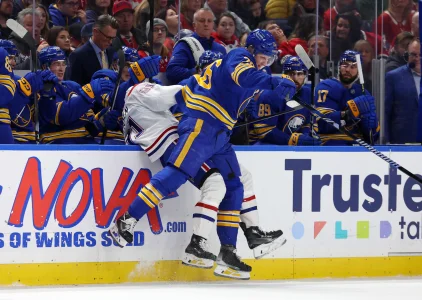 Jan 31, 2026; Buffalo, New York, USA; Buffalo Sabres defenseman Rasmus Dahlin (26) checks Montr�al Canadiens center Oliver Kapanen (91) as he goes after a loose puck during the first period at KeyBank Center.