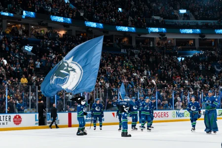 Apr 14, 2026; Vancouver, British Columbia, CAN; Fin the mascot and the Vancouver Canucks celebrate their victory against the Los Angeles Kings at Rogers Arena.