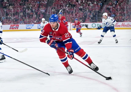 Apr 24, 2026; Montreal, Quebec, CAN; Montreal Canadiens forward Juraj Slafkovsky (20) plays the puck against the Tampa Bay Lightning during the first period in game three of the first round of the 2026 Stanley Cup Playoffs at the Bell Centre.