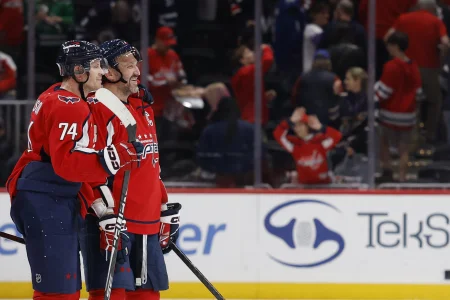 Nov 26, 2025; Washington, District of Columbia, USA; Washington Capitals defenseman John Carlson (74) and Capitals left wing Alex Ovechkin (8) celebrate after their game against the Winnipeg Jets at Capital One Arena.