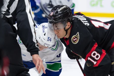 Nov 23, 2024; Ottawa, Ontario, CAN; Vancouver Canucks center Aatu Raty (54) faces off against Ottawa Senators center Tim Stutzle (18) in the second period at the Canadian Tire Centre.