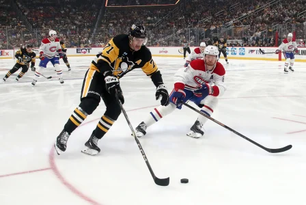 Nov 2, 2024; Pittsburgh, Pennsylvania, USA; Pittsburgh Penguins center Evgeni Malkin (71) moves the puck against the Montreal Canadiens defenseman Mike Matheson (8) during the first period at PPG Paints Arena.