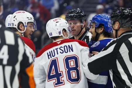 May 3, 2026; Tampa, Florida, USA; Tampa Bay Lightning forward Dominic James (17) argues with Montreal Canadiens forward Jake Evans (71) and defenseman Lane Hutson (48) during the third period in game seven of the first round of the 2026 Stanley Cup Playoffs at Benchmark International Arena.