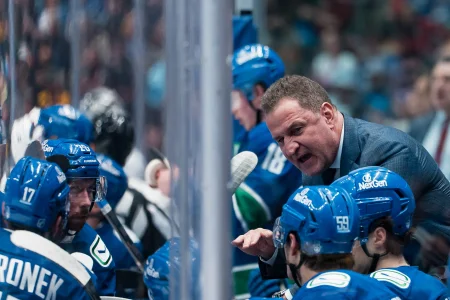 Apr 14, 2026; Vancouver, British Columbia, CAN; Vancouver Canucks head coach Adam Foote talks with defenseman Filip Hronek (17) and defenseman Marcus Pettersson (29) and defenseman Kirill Kudryavtsev (59) on the bench against the Los Angeles Kings in the third period at Rogers Arena.
