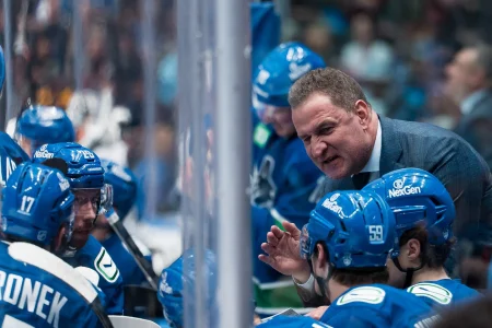 Apr 14, 2026; Vancouver, British Columbia, CAN; Vancouver Canucks head coach Adam Foote talks with defenseman Filip Hronek (17) and defenseman Marcus Pettersson (29) and defenseman Kirill Kudryavtsev (59) on the bench against the Los Angeles Kings in the third period at Rogers Arena.
