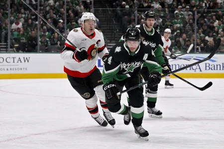 Nov 30, 2025; Dallas, Texas, USA; Ottawa Senators left wing Brady Tkachuk (7) and Dallas Stars defenseman Miro Heiskanen (4) chase the puck during the first period at the American Airlines Center.